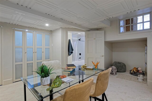 dining area with an ornate ceiling and carpet flooring