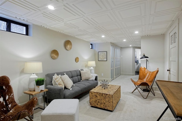 living area featuring baseboards, light carpet, and recessed lighting