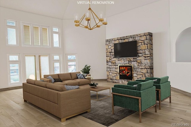 living area with light wood-style floors, a high ceiling, and a fireplace