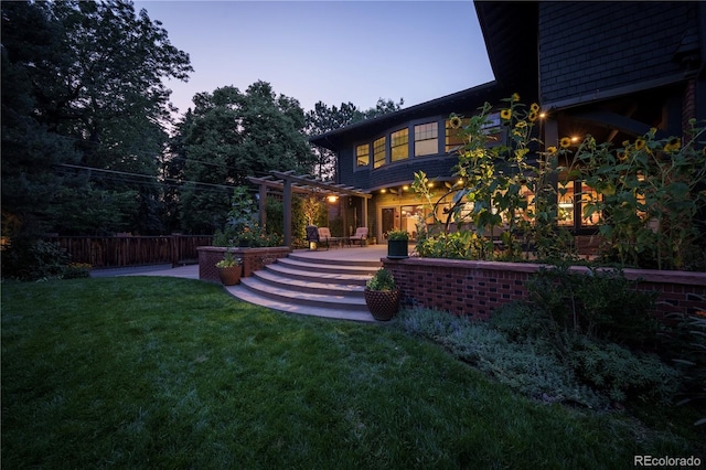 yard at dusk with a deck