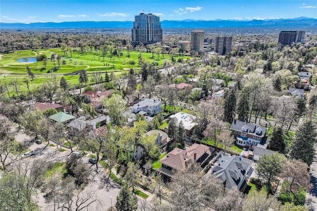 aerial perspective of suburban area featuring a water and mountain view and a local golf course