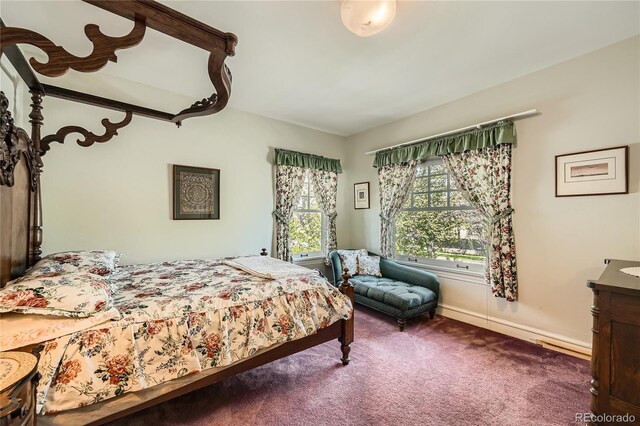 bedroom featuring carpet flooring and baseboards