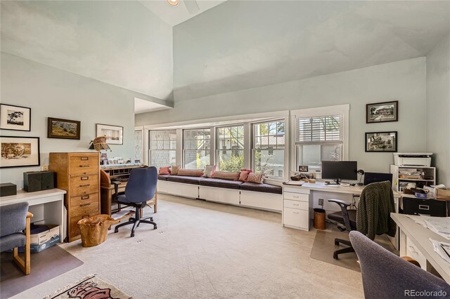 office featuring high vaulted ceiling and light colored carpet