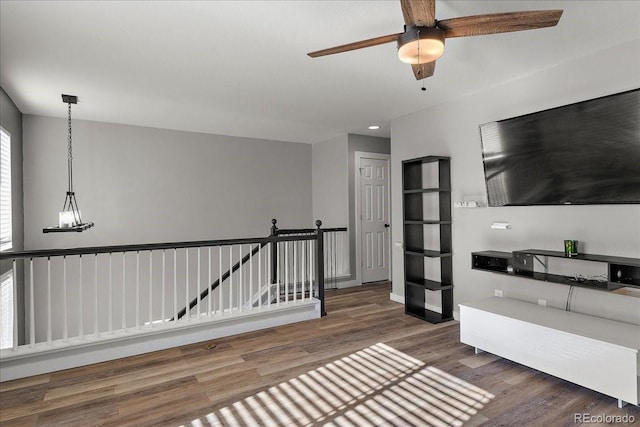 interior space featuring wood finished floors and an upstairs landing