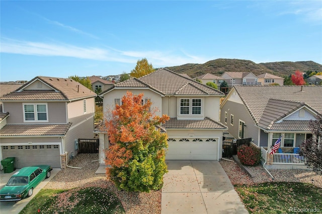 view of front of house featuring a garage and a mountain view