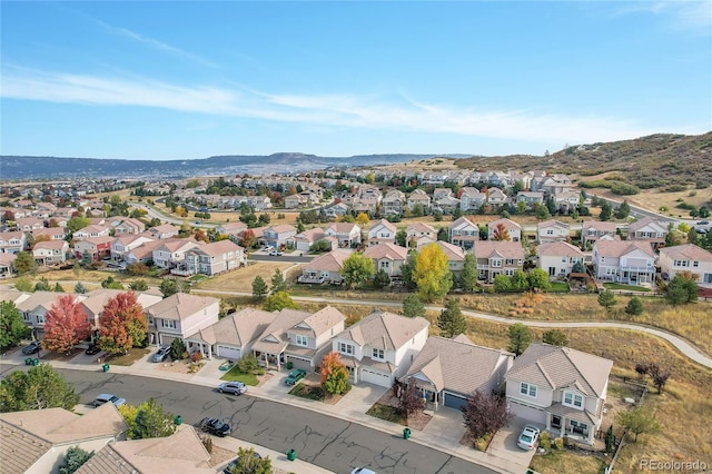 birds eye view of property with a mountain view