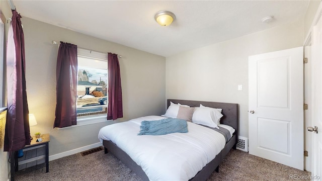 bedroom with carpet flooring, visible vents, and baseboards