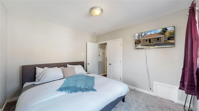 carpeted bedroom with baseboards