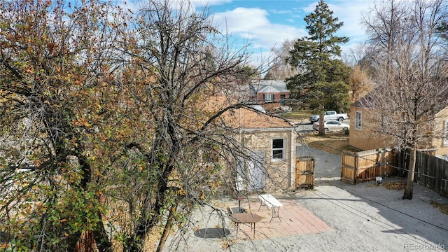 view of home's exterior featuring fence and a patio