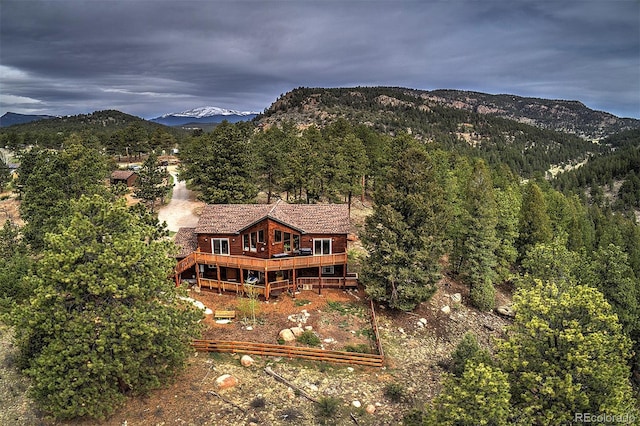 114 Star Ln, Bailey, CO 80421 - aerial view of property and surrounding area featuring a mountainous background and a heavily wooded area
