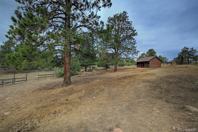 114 Star Ln, Bailey, CO 80421 - view of yard featuring fence, an outdoor structure, and a rural view