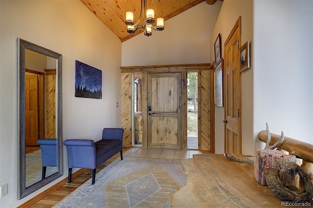 114 Star Ln, Bailey, CO 80421 - foyer entrance featuring a chandelier, wooden ceiling, high vaulted ceiling, and light tile patterned floors