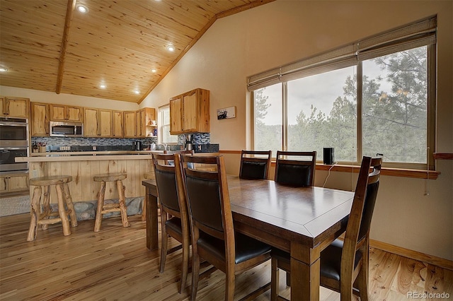 114 Star Ln, Bailey, CO 80421 - dining room featuring light wood-style floors, wooden ceiling, recessed lighting, baseboards, and high vaulted ceiling