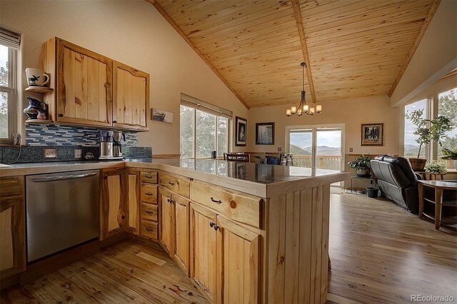 114 Star Ln, Bailey, CO 80421 - kitchen with dishwasher, a peninsula, light wood-style flooring, plenty of natural light, and high vaulted ceiling