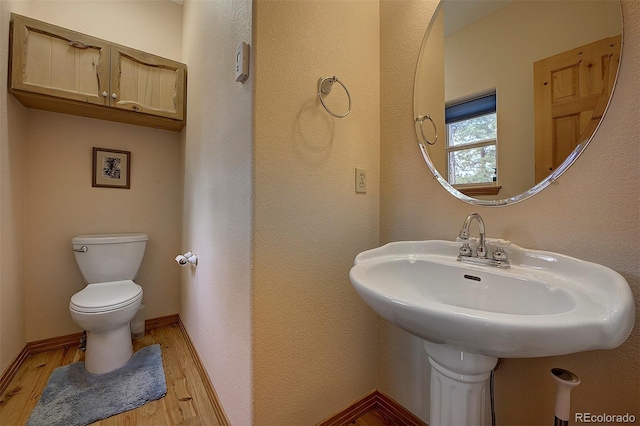 114 Star Ln, Bailey, CO 80421 - half bathroom featuring wood finished floors and toilet