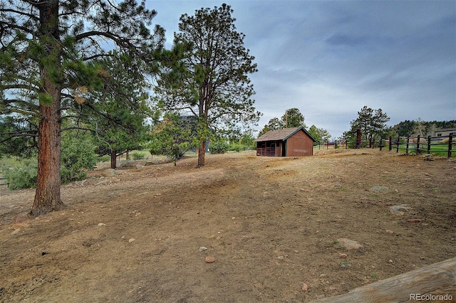 114 Star Ln, Bailey, CO 80421 - view of yard with fence, an outdoor structure, and a rural view