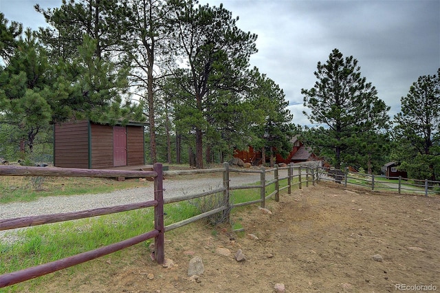 114 Star Ln, Bailey, CO 80421 - view of yard featuring a shed, an outdoor structure, and fence