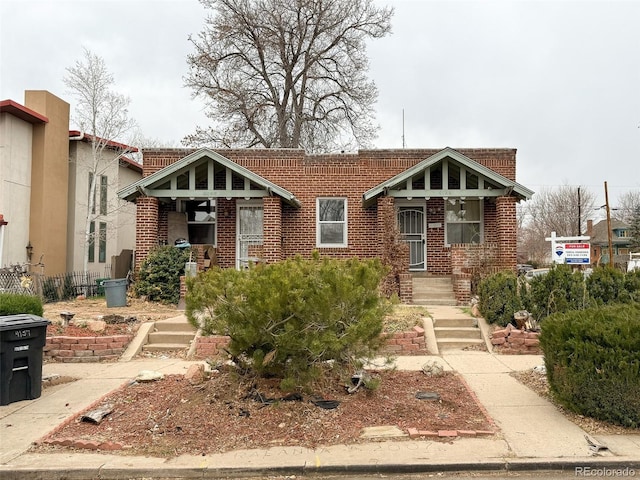 view of front of property featuring brick siding