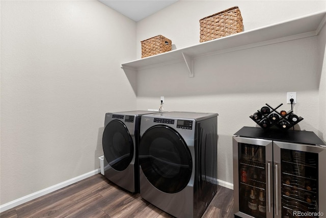 138 Lullaby Ln, Castle Rock, CO 80109 - washroom featuring washer and clothes dryer, wine cooler, dark wood-style floors, and baseboards