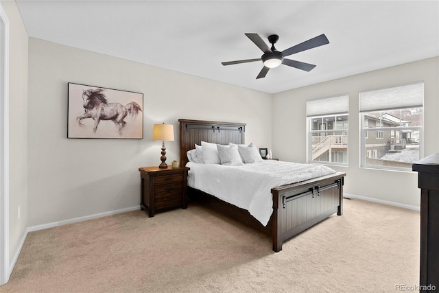 138 Lullaby Ln, Castle Rock, CO 80109 - bedroom featuring light colored carpet, baseboards, and a ceiling fan