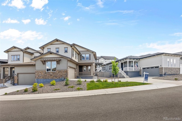 138 Lullaby Ln, Castle Rock, CO 80109 - view of front facade featuring stone siding, concrete driveway, a residential view, board and batten siding, and an attached garage