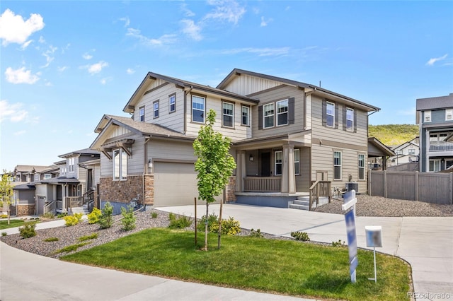 138 Lullaby Ln, Castle Rock, CO 80109 - view of front of home with concrete driveway, an attached garage, and stone siding