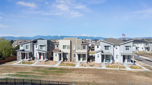 2449 Foerster Grass Vw, Colorado Springs, CO 80915 - multi unit property featuring fence, a residential view, and a mountain view