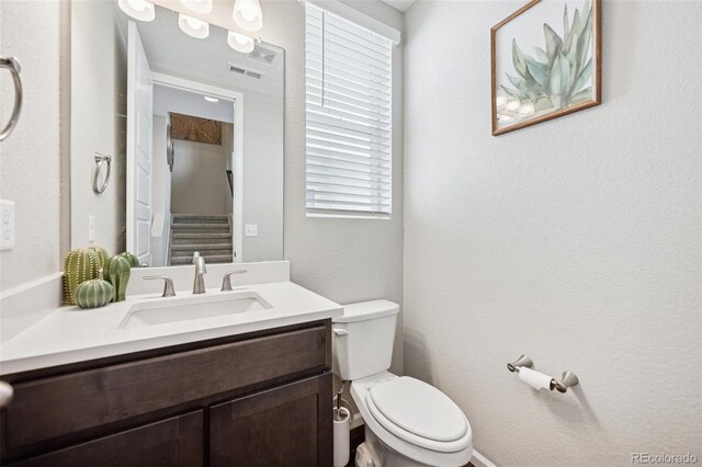 2449 Foerster Grass Vw, Colorado Springs, CO 80915 - bathroom featuring visible vents, toilet, and vanity