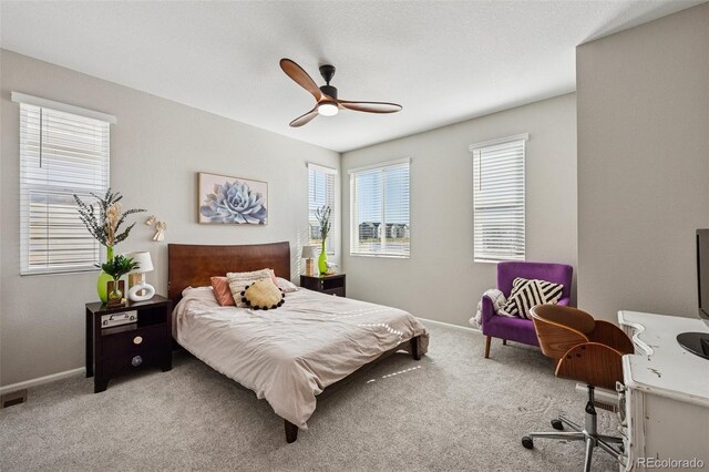 2449 Foerster Grass Vw, Colorado Springs, CO 80915 - carpeted bedroom with ceiling fan, baseboards, and multiple windows