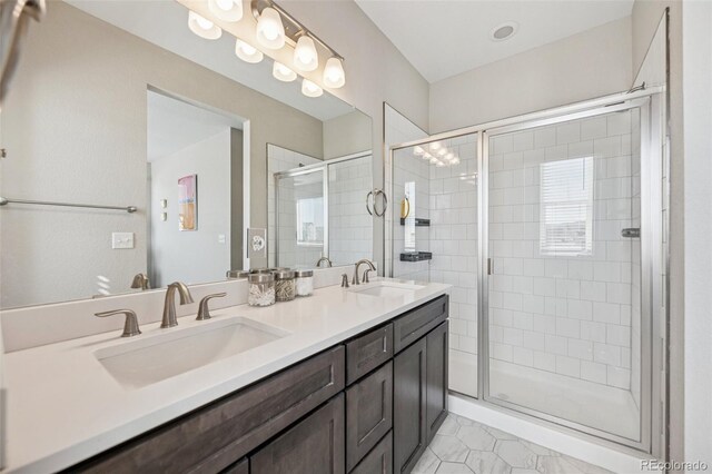 2449 Foerster Grass Vw, Colorado Springs, CO 80915 - bathroom featuring a shower stall, a sink, and double vanity