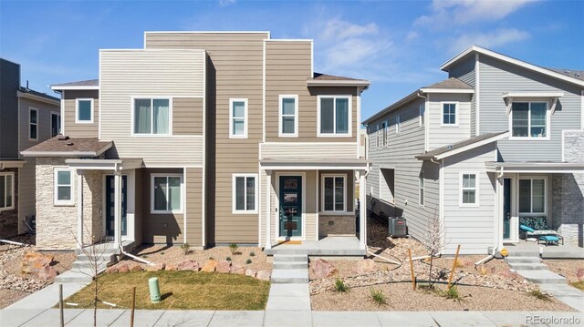 2449 Foerster Grass Vw, Colorado Springs, CO 80915 - view of front of property with central AC unit and stone siding