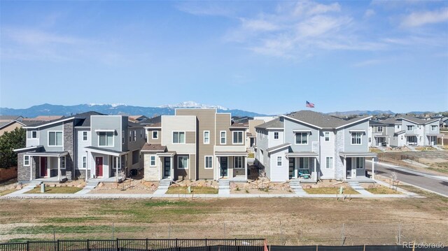 2449 Foerster Grass Vw, Colorado Springs, CO 80915 - view of front of house with fence, a residential view, and a mountain view