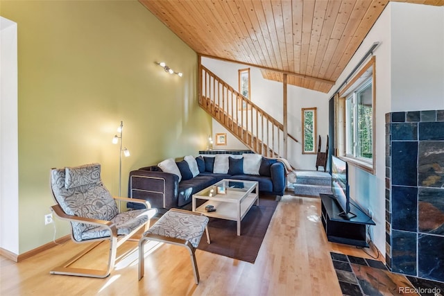 living room featuring wood ceiling, vaulted ceiling, and wood-type flooring