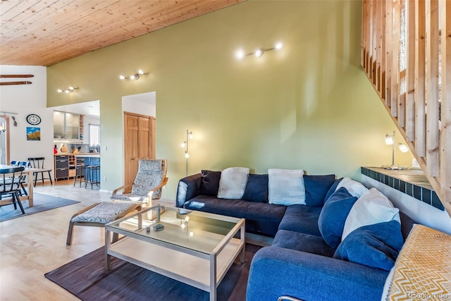 living room with high vaulted ceiling, hardwood / wood-style flooring, and wooden ceiling