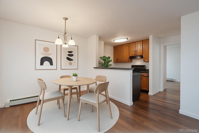 dining room with baseboards, a baseboard radiator, and dark wood-style flooring