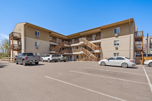 view of property featuring uncovered parking