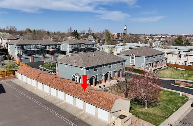 birds eye view of property with a residential view