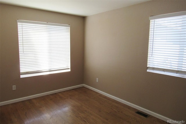 2517 S Genoa St, Aurora, CO 80013 - empty room featuring wood finished floors and baseboards