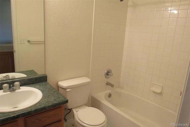 2517 S Genoa St, Aurora, CO 80013 - full bath featuring vanity, toilet, tub / shower combination, and a textured wall