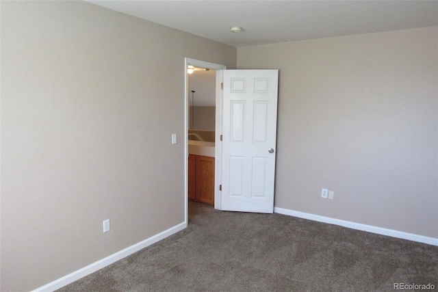 2517 S Genoa St, Aurora, CO 80013 - carpeted spare room featuring baseboards
