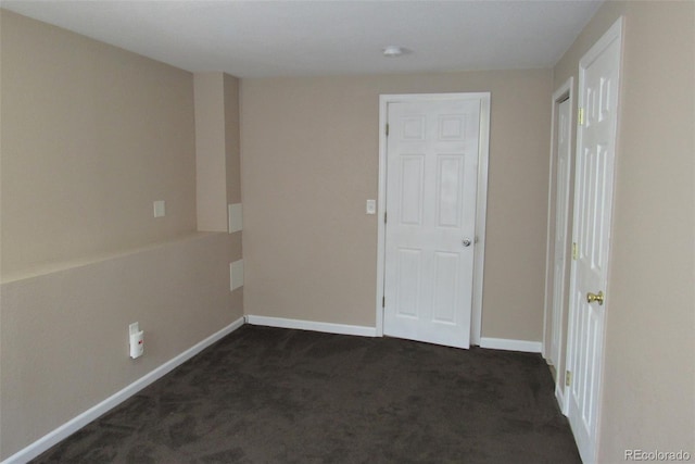 2517 S Genoa St, Aurora, CO 80013 - spare room with dark colored carpet and baseboards