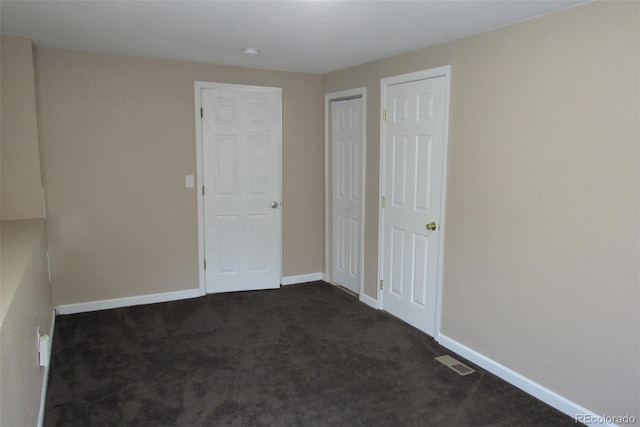 2517 S Genoa St, Aurora, CO 80013 - unfurnished bedroom featuring dark carpet and baseboards