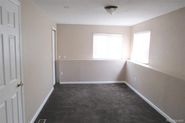 2517 S Genoa St, Aurora, CO 80013 - spare room with dark carpet and baseboards