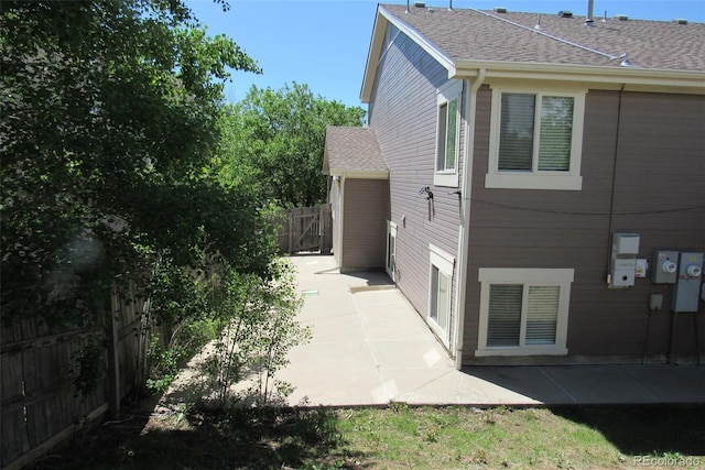 2517 S Genoa St, Aurora, CO 80013 - view of home's exterior with a patio and a shingled roof