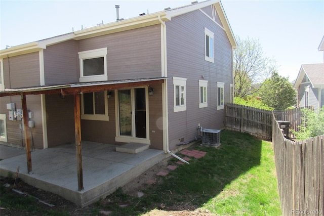 2517 S Genoa St, Aurora, CO 80013 - rear view of house featuring a patio and central AC unit