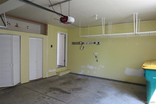 2517 S Genoa St, Aurora, CO 80013 - garage with a garage door opener and baseboards