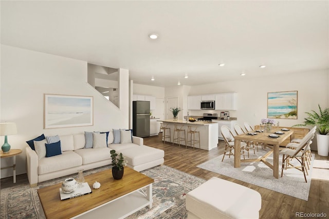 27746 E Byers Pl, Aurora, CO 80018 - living area featuring dark wood finished floors and recessed lighting