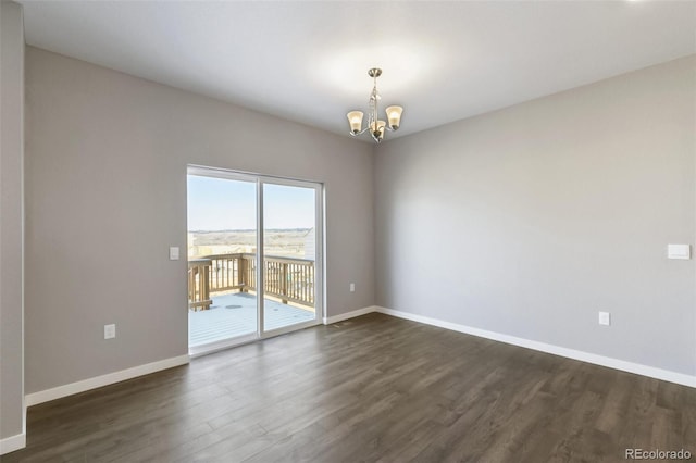 27746 E Byers Pl, Aurora, CO 80018 - empty room with a chandelier, dark wood-style floors, and baseboards