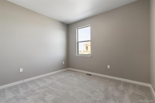 27746 E Byers Pl, Aurora, CO 80018 - unfurnished room featuring light carpet and baseboards