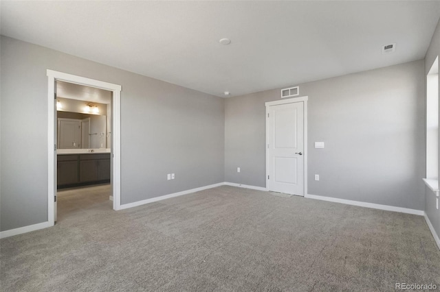 27746 E Byers Pl, Aurora, CO 80018 - unfurnished bedroom featuring carpet, baseboards, and ensuite bathroom